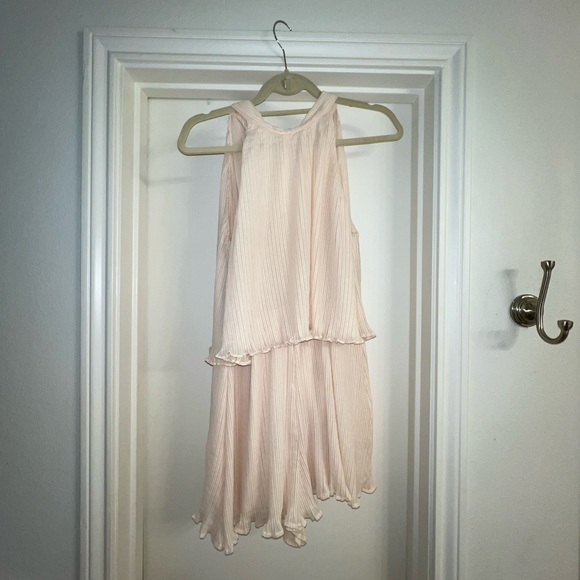 Adorable cream chiffon ruffle short romper with tie back. Open winged back. - Picture 4 of 13